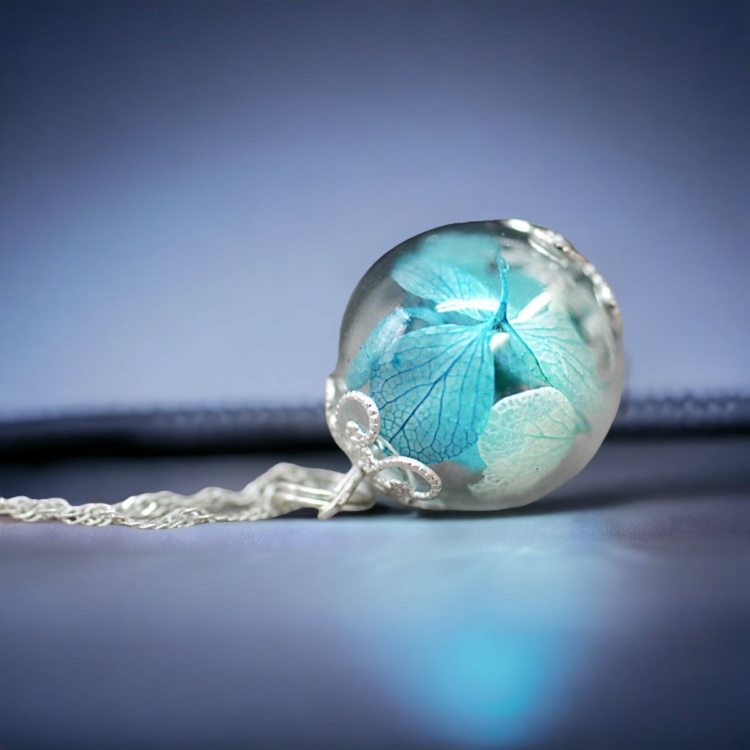 Joy of life in glass and silver: hydrangea flowers in a transparent glass ball on a 925 sterling silver chain